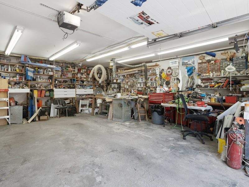 Cluttered garage before cleanout in Scottsdale, AZ